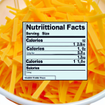 how many calories in 1 oz shredded cheddar cheese